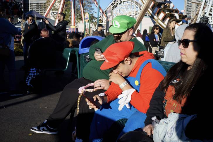 people dressed up as Mario and Luigi for Halloween at Coney Island